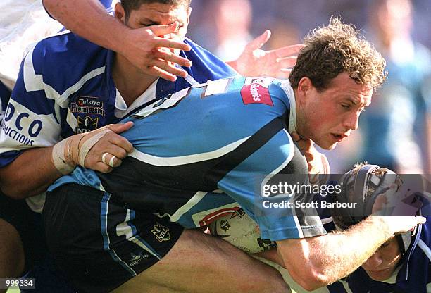 Colin Best of the Sharks is tackled during the NRL second semi final match between the Bulldogs and the Cronulla Sharks held at the Sydney Football...