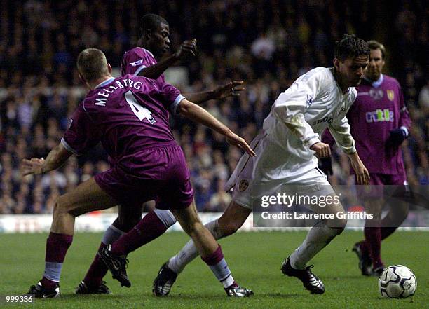 Eirik Bakke of Leeds skips past Olof Mellberg of Aston Villa during the FA Barclaycard Premiership game between Leeds United and Aston Villa at...