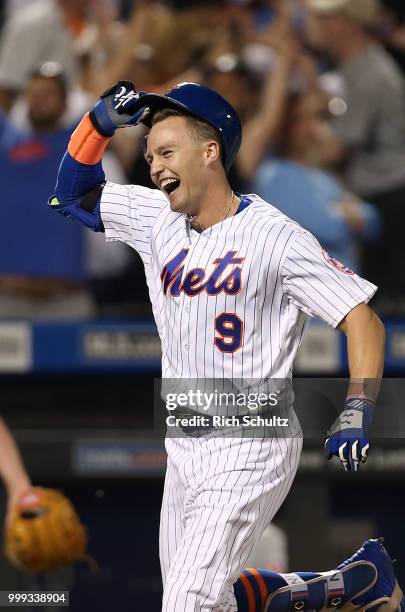 Brandon Nimmo of the New York Mets reacts after he hit a 10th inning pinch-hit walk-off home run against the Philadelphia Phillies during a game at...