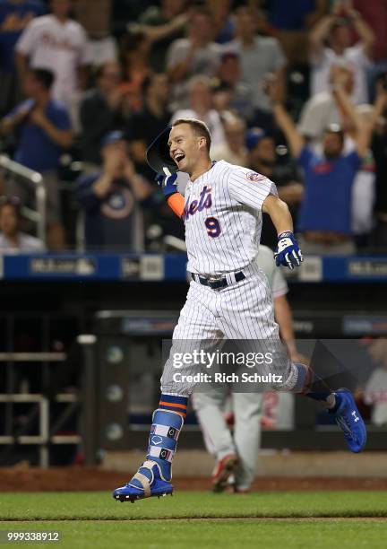 Brandon Nimmo of the New York Mets reacts after he hit a 10th inning pinch-hit walk-off home run against the Philadelphia Phillies during a game at...