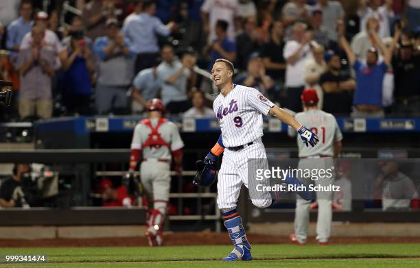 Brandon Nimmo of the New York Mets reacts after he hit a 10th inning pinch-hit walk-off home run against the Philadelphia Phillies during a game at...