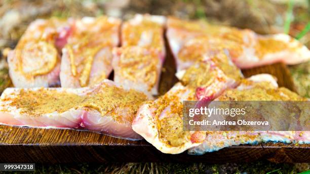 freshly caught carp filleted and seasoned, prepared for cooking - filleted stock pictures, royalty-free photos & images