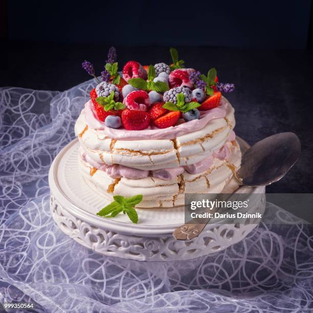 pavlova with berry fruits - berry stock-fotos und bilder