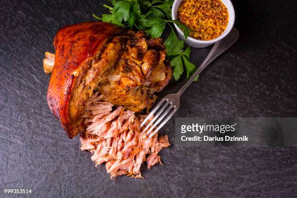 fresh roasted knuckle of pork with mustard - mustard stock-fotos und bilder
