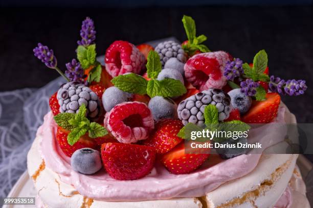 pavlova with berry fruits - berry stock-fotos und bilder