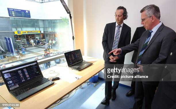 Federal Minister of the Interior Thomas de Maizière being briefed regarding the face recognition project taking place in the Sudkreuz train station...