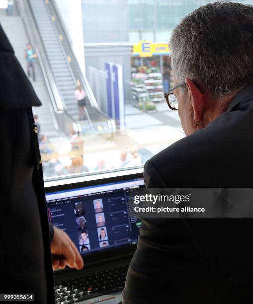 Federal Minister of the Interior Thomas de Maizière being briefed regarding the face recognition project taking place in the Sudkreuz train station...