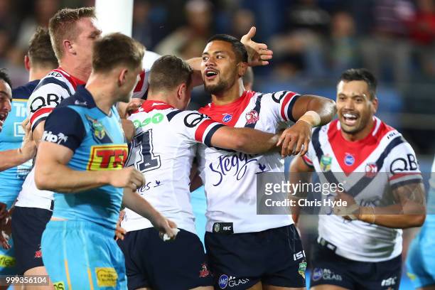 Poasa Faamausili of the Roosters celebrates a try during the round 18 NRL match between the Gold Coast Titans and the Sydney Roosters at Cbus Super...