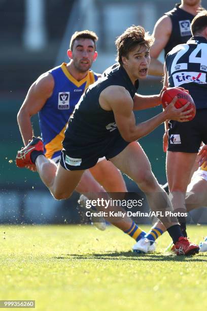 Samuel Fisher of the Blues runs with the ball during the round 15 VFL match between the Northern Blues and Williamstown at Ikon Park on July 15, 2018...