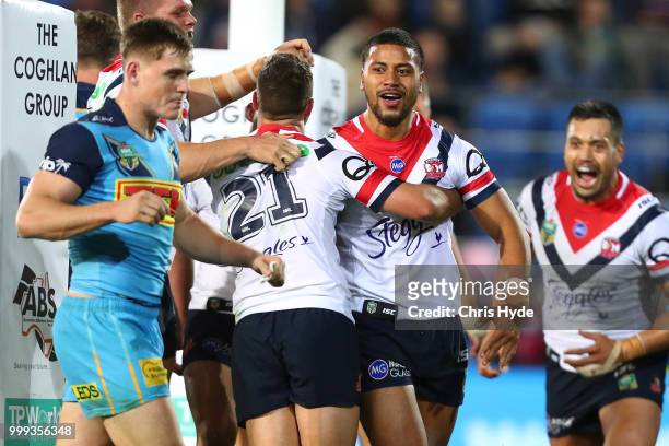 Poasa Faamausili of the Roosters celebrates a try during the round 18 NRL match between the Gold Coast Titans and the Sydney Roosters at Cbus Super...