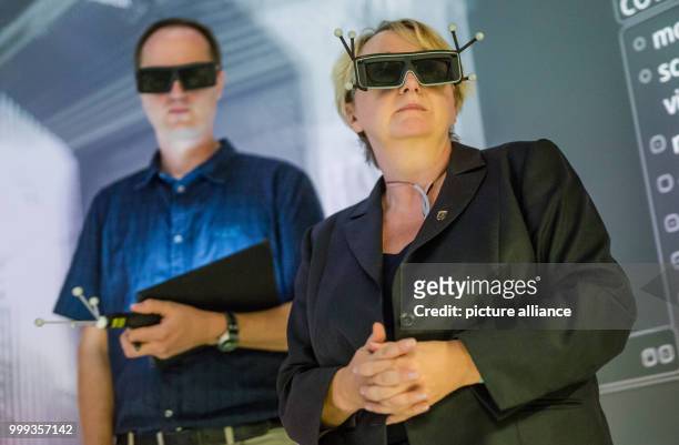 Theresia Bauer , Science Minister for the state of Baden-Wurttemberg visiting a room with 3D projections in Stuttgart University in Stuttgart,...