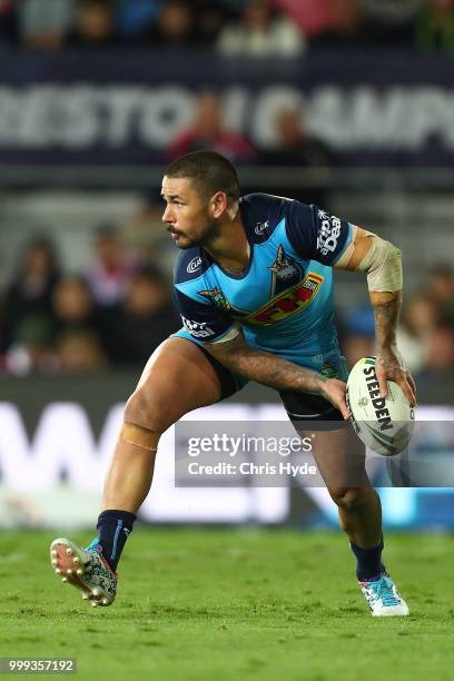 Nathan Peats of the Titans passes during the round 18 NRL match between the Gold Coast Titans and the Sydney Roosters at Cbus Super Stadium on July...