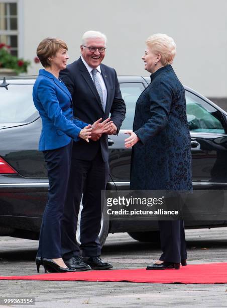 German President Frank-Walter Steinmeier and his wife Elke Budenbender being greeted with military honours by the President of the Republic of...