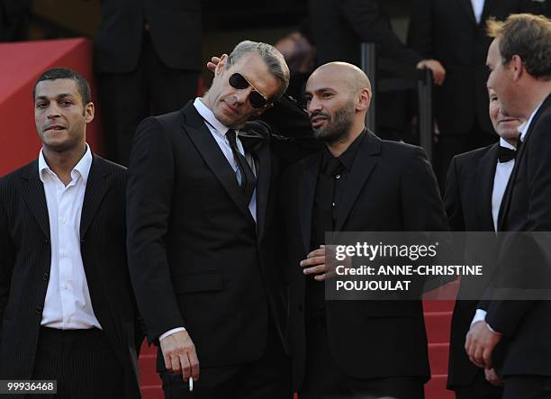 French actor Adel Bencherif, French actor Lambert Wilson and French actor Farid Larbi arrive for the screening of "Des Hommes et des Dieux" presented...
