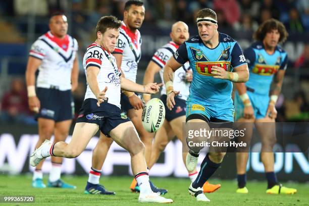 Luke Keary of the Roosters kicks during the round 18 NRL match between the Gold Coast Titans and the Sydney Roosters at Cbus Super Stadium on July...