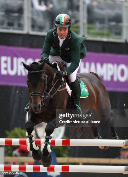 Irish show jumper Cian O'Connor on his horse Good Luck during the Show Jumping Team Event of the FEI European Championships 2017 in Gothenburg,...