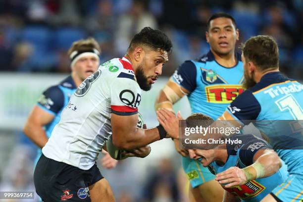 Isaac Liu of the Roosters runs the ball during the round 18 NRL match between the Gold Coast Titans and the Sydney Roosters at Cbus Super Stadium on...