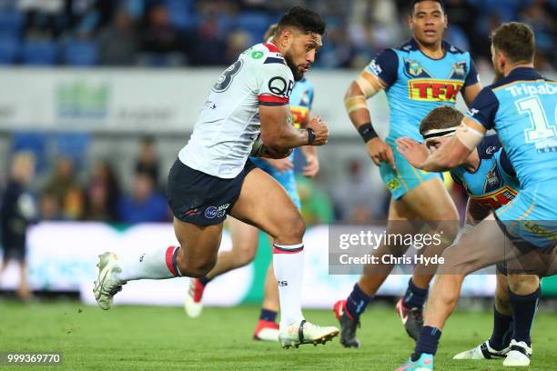 Isaac Liu of the Roosters runs the ball during the round 18 NRL match between the Gold Coast Titans and the Sydney Roosters at Cbus Super Stadium on...