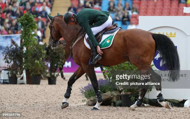 Irish show jumper Denis Lynch on his horse All Star 5 during the Show Jumping Team Event of the FEI European Championships 2017 in Gothenburg,...