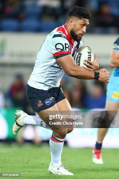 Isaac Liu of the Roosters runs the ball during the round 18 NRL match between the Gold Coast Titans and the Sydney Roosters at Cbus Super Stadium on...