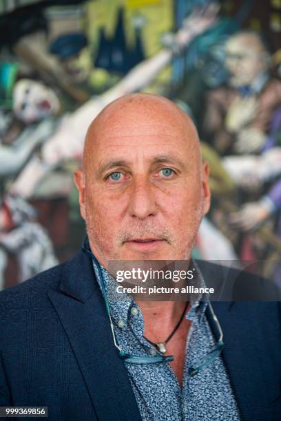 Christian Zott, managing director of the company "mSE Solutions" is being pictured in front of a painting by Beltracchi in his office in Munich,...