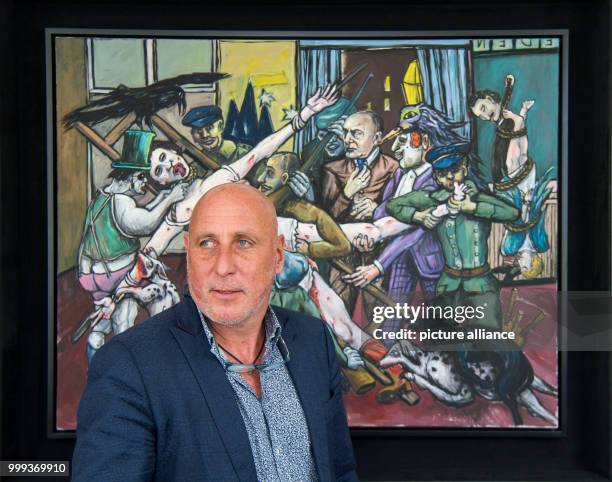 Christian Zott, managing director of the company "mSE Solutions" is being pictured in front of a painting by Beltracchi in his office in Munich,...