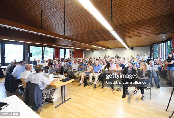 Employees of the German railway provider "Deutsche Bahn AG" share information on the actions to repair the tracks with interested citizens....