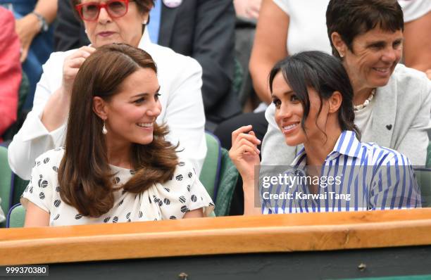 Catherine, Duchess of Cambridge and Meghan, Duchess of Sussex attend day twelve of the Wimbledon Tennis Championships at the All England Lawn Tennis...