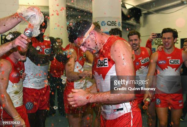 Colin O'Riordan of the Swans is sprayed with drinks after Swans won the round 17 AFL match between the North Melbourne Kangaroos and the Sydney Swans...