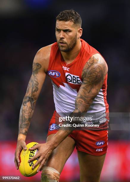 Lance Franklin of the Swans kicks during the round 17 AFL match between the North Melbourne Kangaroos and the Sydney Swans at Etihad Stadium on July...