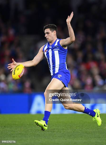 Paul Ahern of the Kangaroos kicks during the round 17 AFL match between the North Melbourne Kangaroos and the Sydney Swans at Etihad Stadium on July...