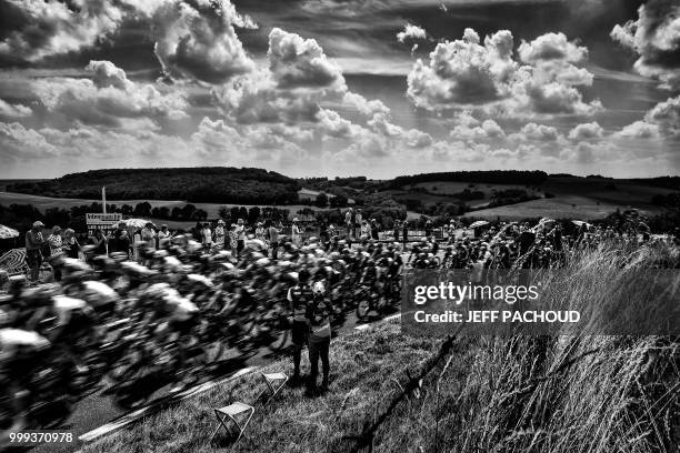 The pack chases a two-men breakaway near Les Andelys during the eighth stage of the 105th edition of the Tour de France cycling race between Dreux...