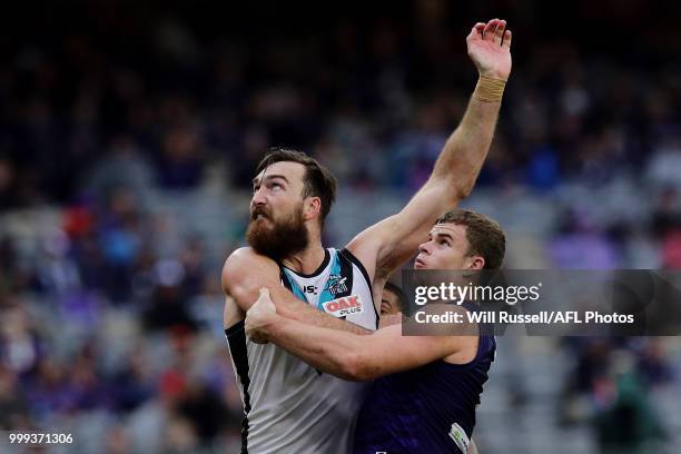 Charlie Dixon of the Power contests a ruck with Sean Darcy of the Dockers during the round 17 AFL match between the Fremantle Dockers and the Port...