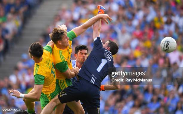 Dublin , Ireland - 14 July 2018; Dublin captain and goalkeeper Stephen Cluxton, his teammate Cian O'Sullivan together with Donegal players Michael...