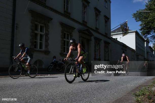 Athletes perform in the bike leg during the Age Group olympic distance race at the ITU World Triathlon Hamburg 2018 on July 15, 2018 in Hamburg,...