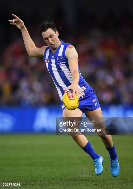 Sam Wright of the Kangaroos kicks during the round 17 AFL match between the North Melbourne Kangaroos and the Sydney Swans at Etihad Stadium on July...