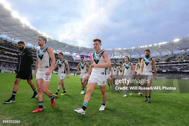 The Power leave the field after the teams defeat during the round 17 AFL match between the Fremantle Dockers and the Port Adelaide Power at Optus...