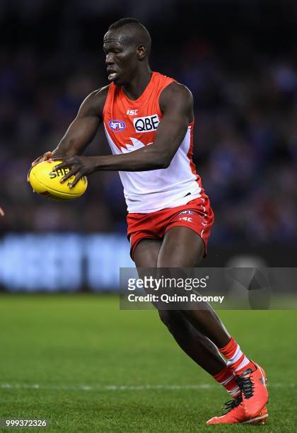 Aliir Aliir of the Swans kicks during the round 17 AFL match between the North Melbourne Kangaroos and the Sydney Swans at Etihad Stadium on July 15,...