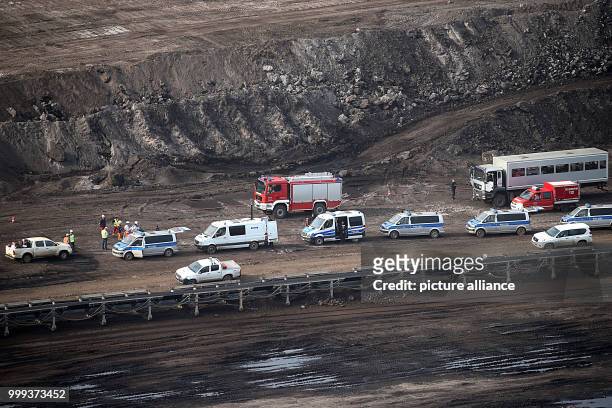 Police vehicles pictured at the Inden surface mine near Duren, Germany, 25 August 2017. 13 activists left an occupied brown coal excavator in the...