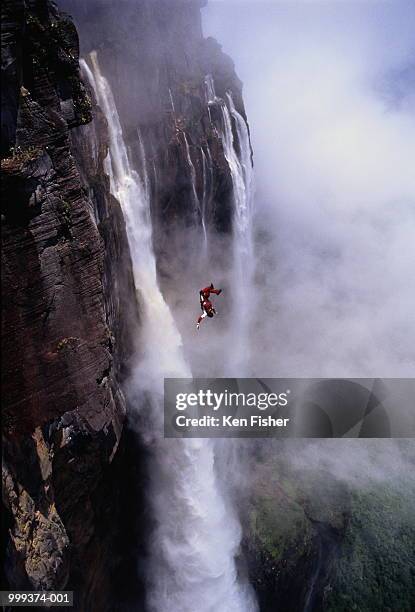 man base jumping off angel falls, venezuela - angel falls bildbanksfoton och bilder