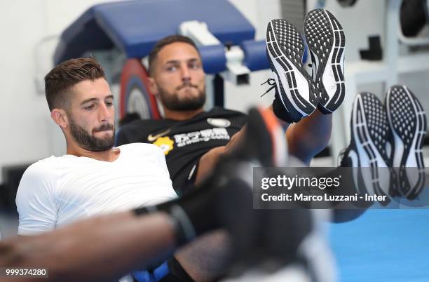 Roberto Gagliardini and Danilo D Ambrosio of FC Internazionale train in the gym during the FC Internazionale training session at the club's training...