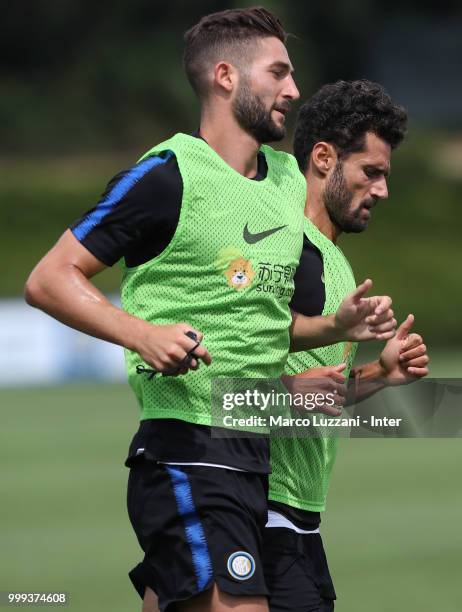 Roberto Gagliardini and Antonio Candreva of FC Internazionale run during the FC Internazionale training session at the club's training ground Suning...