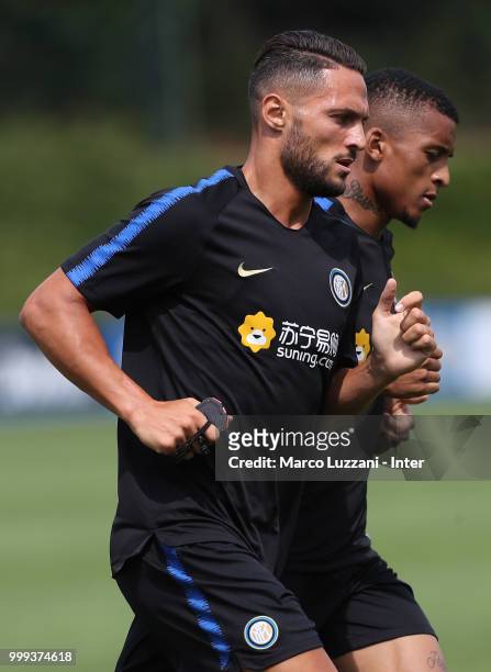 Danilo D Ambrosio and Henrique Dalbert of FC Internazionale run during the FC Internazionale training session at the club's training ground Suning...