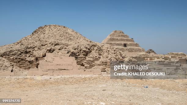 Picture taken on July 14, 2018 shows a view of pyramids in the Saqqara necropolis, about 35 kms south of the Egyptian capital Cairo, with the King...
