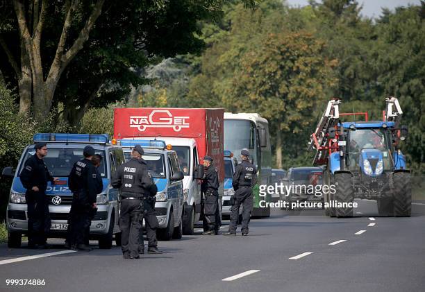 Police officers searching vehicles in front of the Climate Camp near Erkelenz, Germany, 25 August 2017. Environment activists are attempting to...