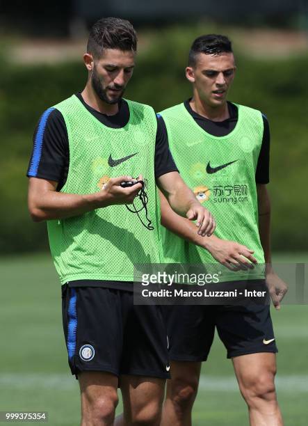 Roberto Gagliardini and Gabriele Zappa of FC Internazionale look on during the FC Internazionale training session at the club's training ground...