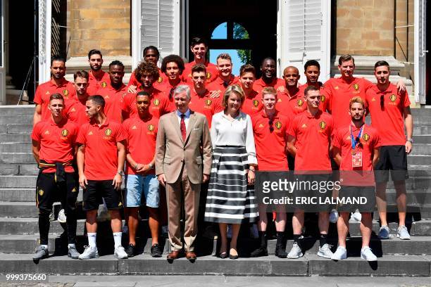Belgium's King Philippe - Filip of Belgium and Queen Mathilde of Belgium pose for a picture with Belgium's team players forward Thorgan Hazard,...