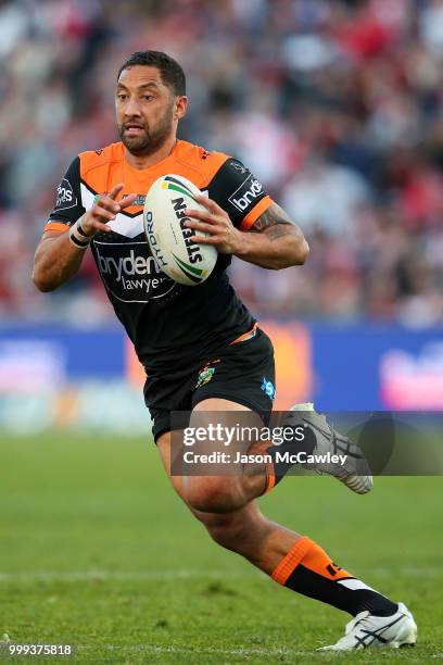 Benji Marshall of the Tigers runs the ball during the round 18 NRL match between the St George Illawarra Dragons and the Wests Tigers at UOW Jubilee...