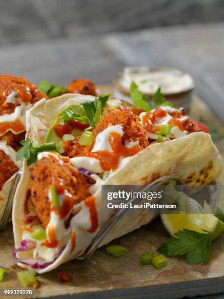 crispy baked buffalo wing cauliflower tacos - buffalo chicken wings stock pictures, royalty-free photos & images