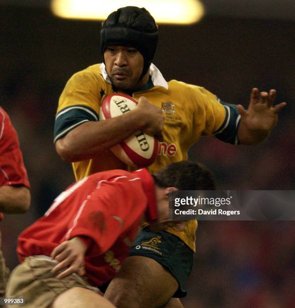Rob Howley of Wales trys to stop Toutai Kefu of Australia during the match between Wales and Australia at the Millennium Stadium, Cardiff. DIGITAL...